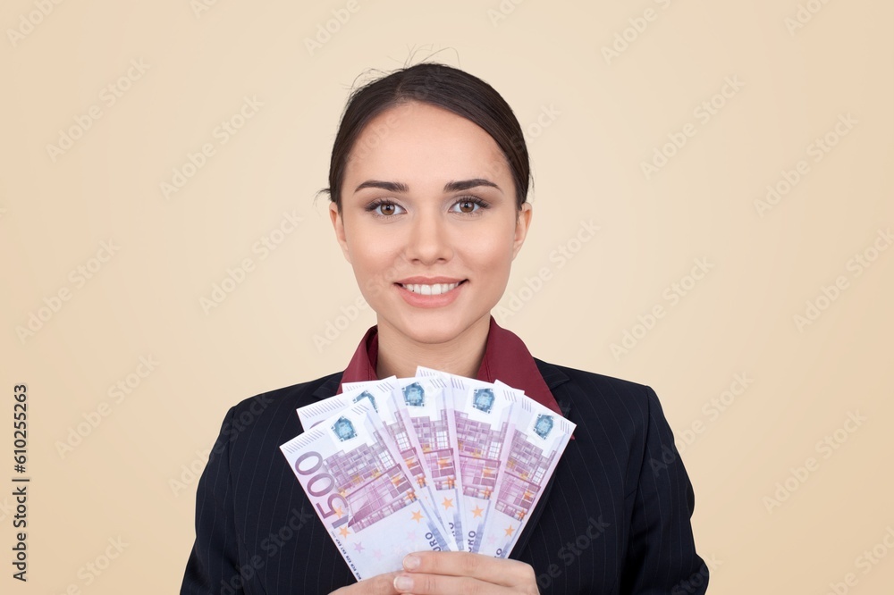 Enthusiastic young woman hold money, celebrating Enthusiastic young woman hold money, celebrating