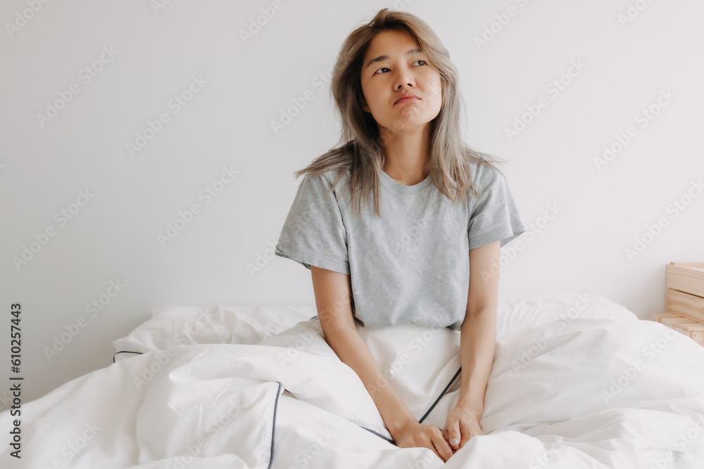 Sleepy and dreaming asian woman just wake up on the bed. Sleepy and dreaming asian woman just wake up on the bed.