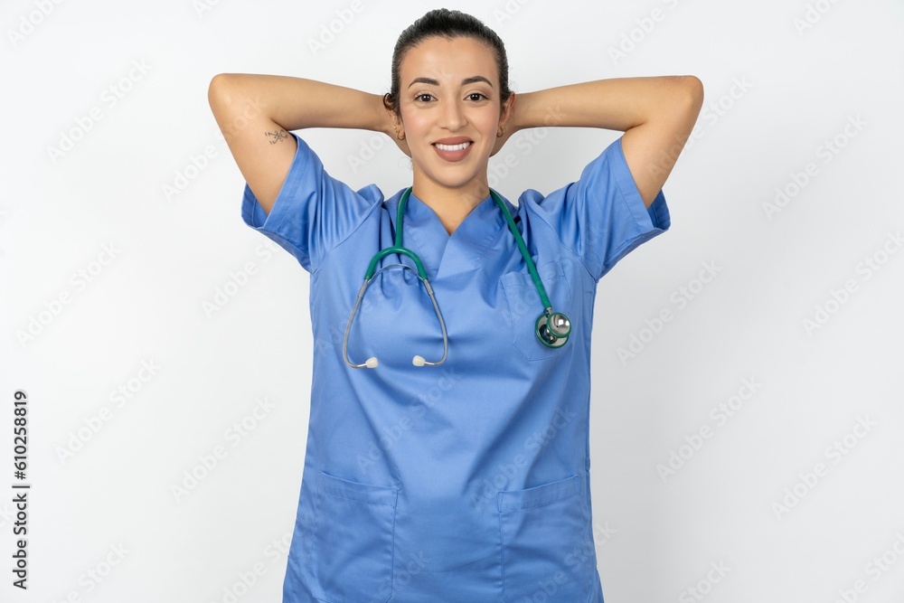 Satisfied Beautiful doctor woman standing over white studio background hold hands behind head relaxing Satisfied Beautiful doctor woman standing over white studio background hold hands behind head relaxing
