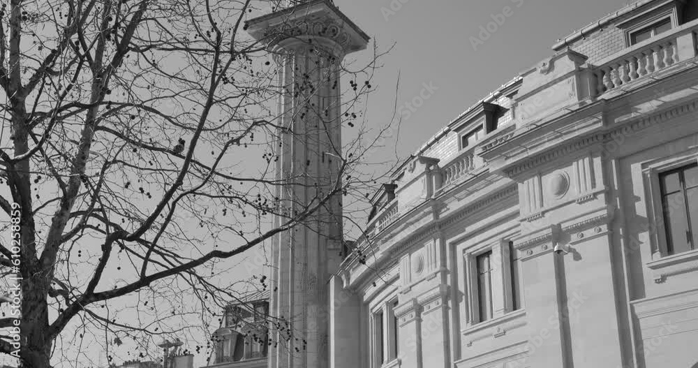 Black and white shot of Bourse de commerce, Commodities Exchange building in Paris, France on a sunny day. Tilt down. Black and white shot of Bourse de commerce, Commodities Exchange building in Paris, France on a sunny day. Tilt down.