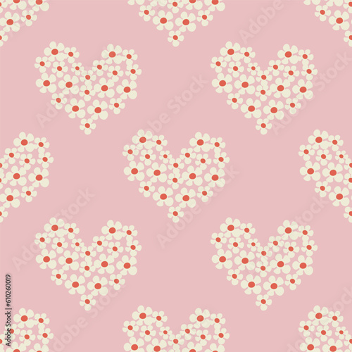 Seamless pattern with heart shape with flowers of daisy flowers in Groovy style on a pink background