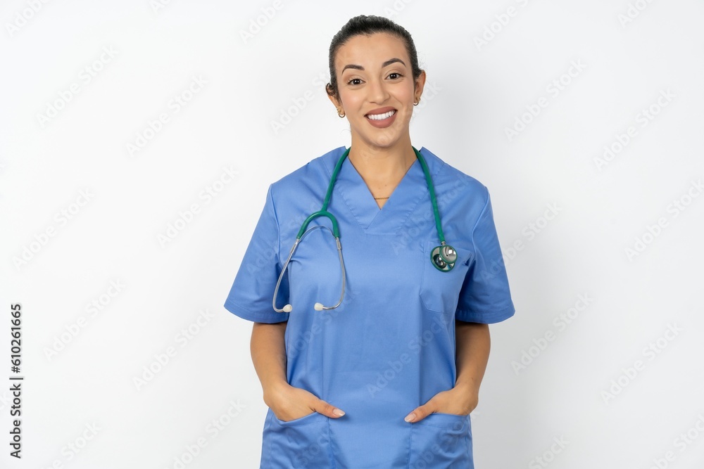 Beautiful doctor woman standing over white studio background with a happy and cool smile on face. Lucky person. Beautiful doctor woman standing over white studio background with a happy and cool smile on face. Lucky person.