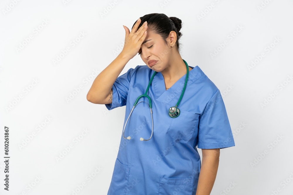 A very upset and lonely Beautiful doctor woman standing over white studio background crying, A very upset and lonely Beautiful doctor woman standing over white studio background crying,