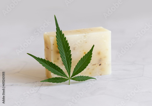 Wallpaper Mural Craft soap bar near green cannabis leaves on white marble table. Cosmetic Mockup Torontodigital.ca