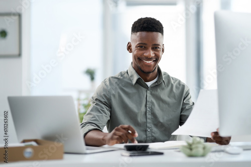 Black man, portrait and laptop with documents for finance, audit or accounting at the office desk. Happy African male accountant or businessman with smile for financial planning, budget or paperwork
