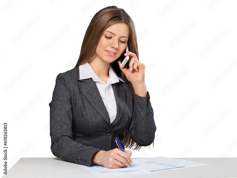 Business woman sitting at the white table and make notes Business woman sitting at the white table and make notes