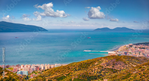 Astonishing spring cityscape of Vlore city from Kanines fortress. Beautiful morning sescape of Adriatic sea. Aerial outdoor scene of Albania, Europe. Traveling concept background.
