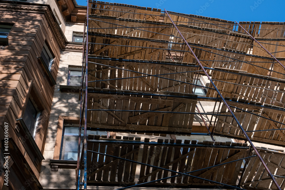 Bottom view of scaffolding on the facade of a residential building