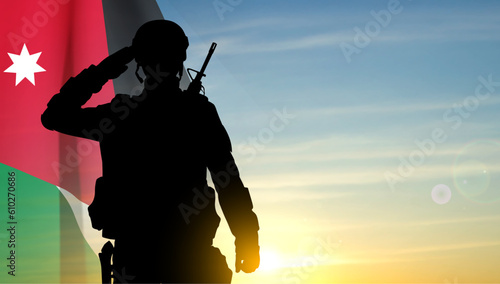 Silhouette of a saluting soldier with Jordan flag on background of sunset sky. Concept - Independence Day, Armed Force. EPS10 vector