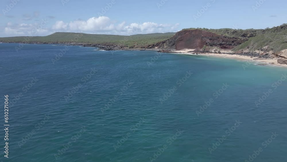 Aerial view of Make Horse beach in Maunaloa, Hawaii. Flight over the ocean with cliffs on the background. Aerial view of Make Horse beach in Maunaloa, Hawaii. Flight over the ocean with cliffs on the background.