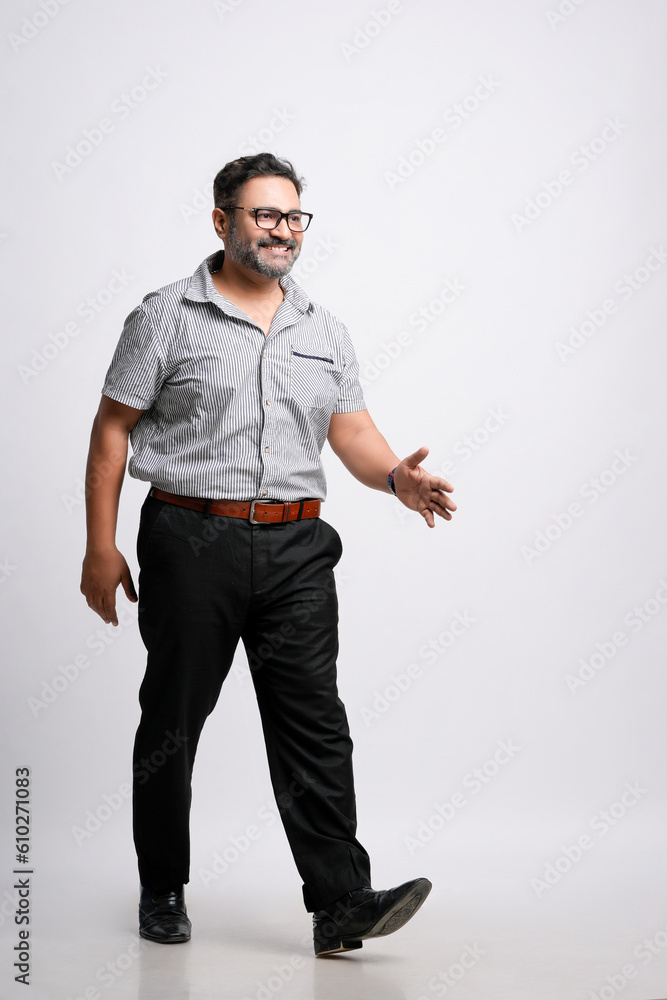 Young indian man in casual look on white background. Young indian man in casual look on white background.