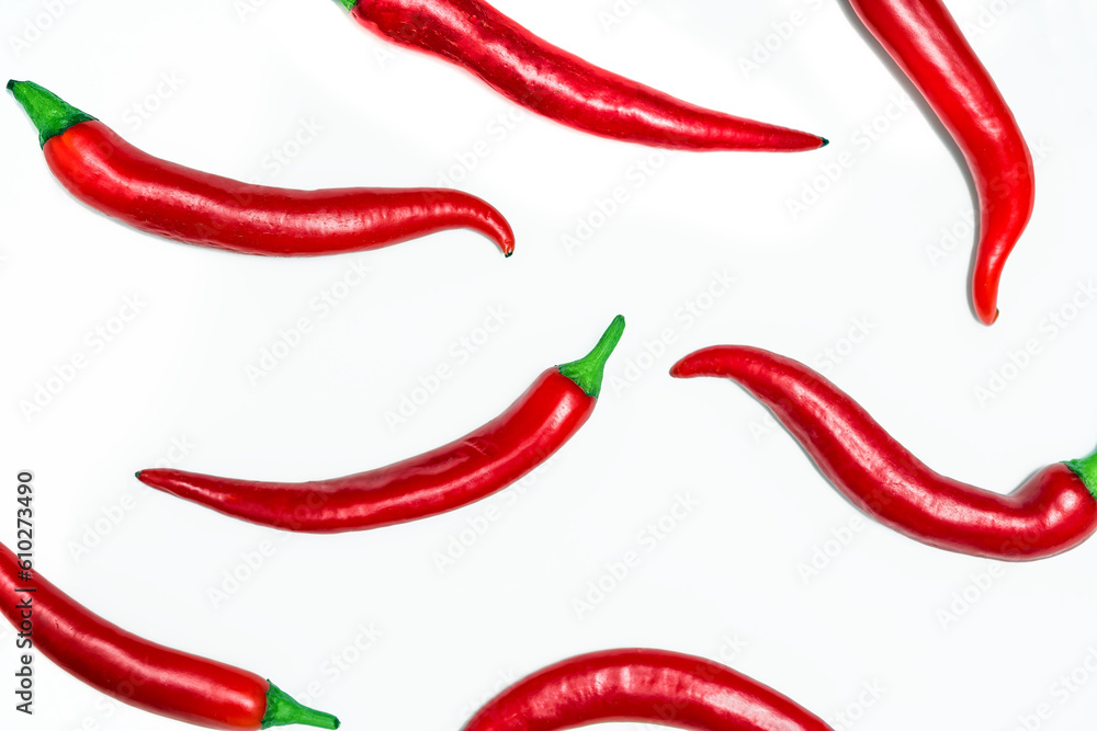 Red chilli peppers pattern on white background. Top view. Hot pepper flat lay. Chili wallpaper Red chilli peppers pattern on white background. Top view. Hot pepper flat lay. Chili wallpaper