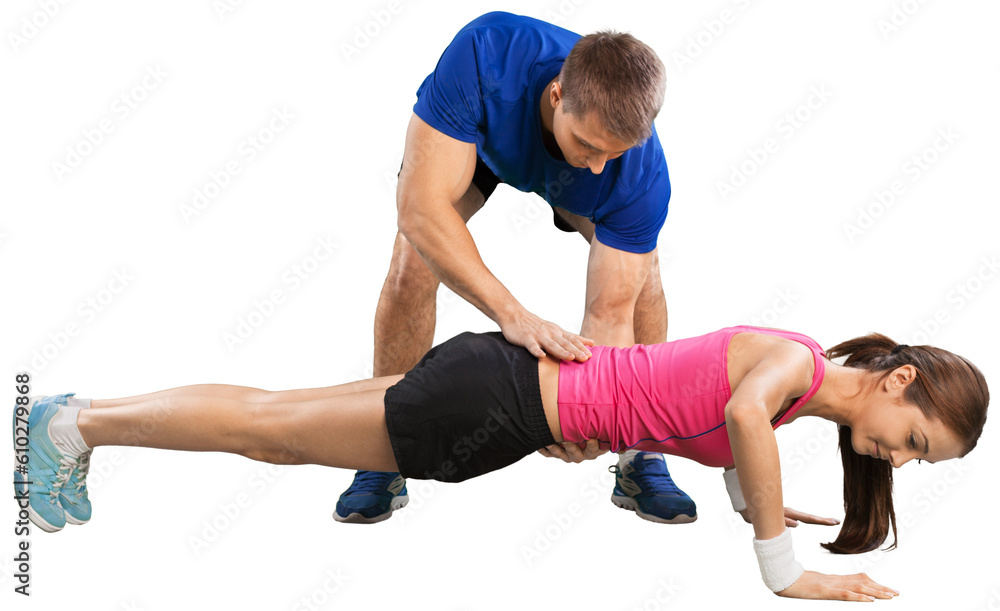 Happy caucasian couple man woman personal trainer exercising Happy caucasian couple man woman personal trainer exercising