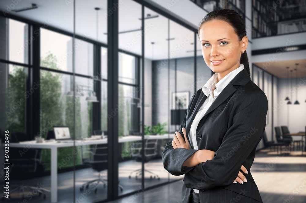Successful business female stands in modern office Successful business female stands in modern office