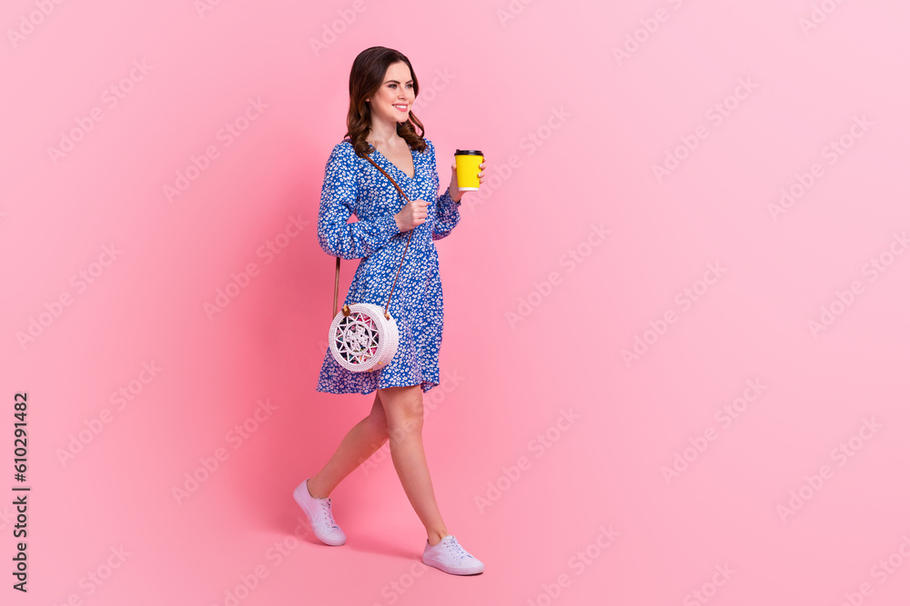 Full length photo of cute adorable gorgeous lady wear trendy clothes going empty space restaurant isolated on pink color background Full length photo of cute adorable gorgeous lady wear trendy clothes going empty space restaurant isolated on pink color background