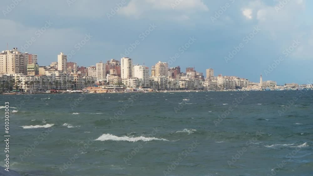 Sea Waves and Distant Buildings of a Big City (Alexandria, Egypt) Sea Waves and Distant Buildings of a Big City (Alexandria, Egypt)