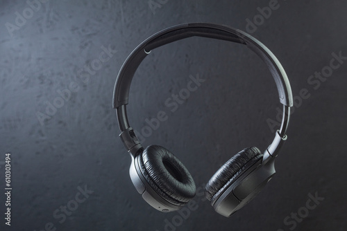 Large wireless headphones on a dark background