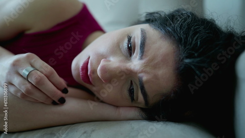 Worried woman in despair suffering from emotional distress as she expresses pressure and frowns while feeling sad and in stress