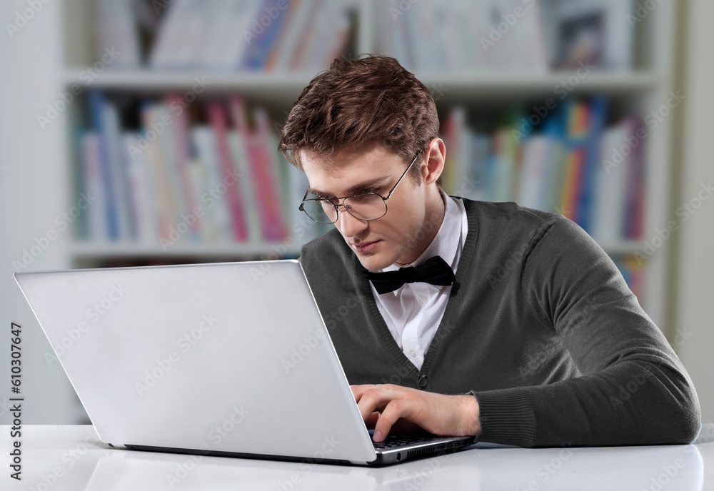 Happy young business man using laptop Happy young business man using laptop