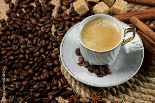 A cup of espresso on a background of coffee beans. Cup of fresh coffee © Ruzanna