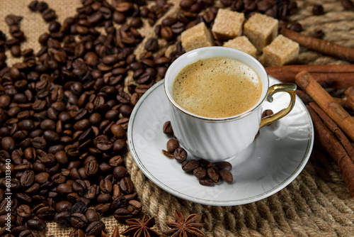 A cup of espresso on a background of coffee beans. Cup of fresh coffee © Ruzanna