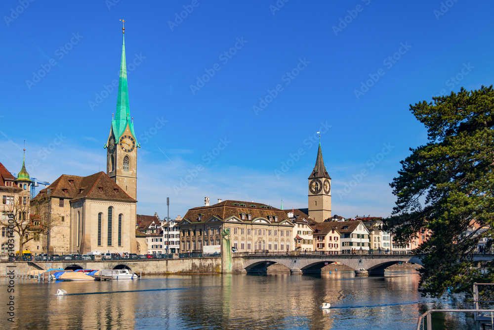 Panoramic view of the Limat River in Zurich, Monterbrücke Cathedral Bridge, historic buildings and monasteries 