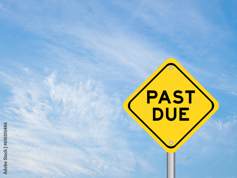 Yellow transportation sign with word past due on blue color sky background Yellow transportation sign with word past due on blue color sky background
