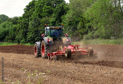 Obraz na płótnie Tractor Tilling a Field w salonie