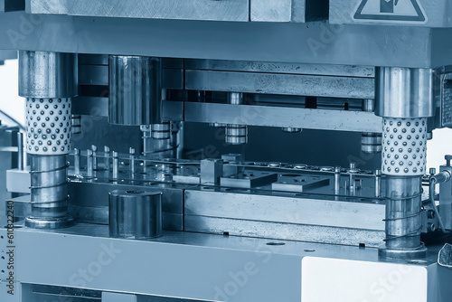 Closeup scene of the progressive die operation in the light blue scene.