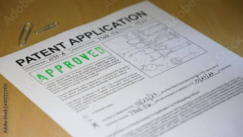 A patent application document form gets approved. Data on form is fictional.  	