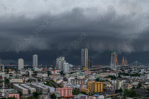 A heavy storm with rain and dramatic atmosphere clouds can be a sight to behold over a city center.