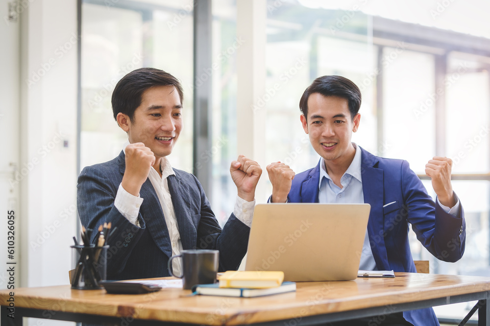 Business team celebrating successful project or achievement in office. Teamwork, collaboration concept. Business team celebrating successful project or achievement in office. Teamwork, collaboration concept.