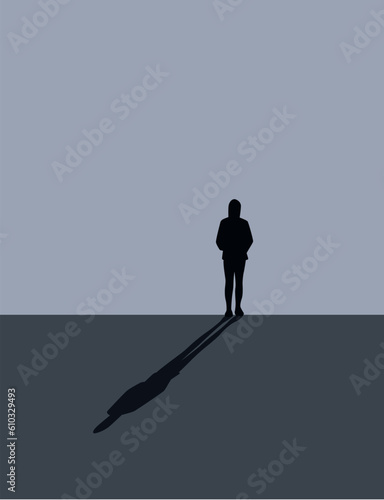 lonely sad girl stands in front of a gray wall