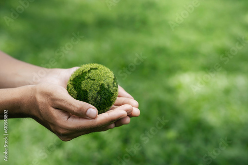 Environment Earth Day In the hands holding green earth. care, saving and energy are renewable and the environment is sustainable. Save Earth. Concept of the Environment World Earth Day.