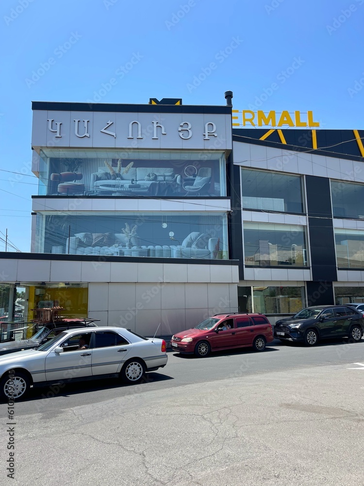 Street with furniture stores in Yerevan. Road, cars. Shopping in