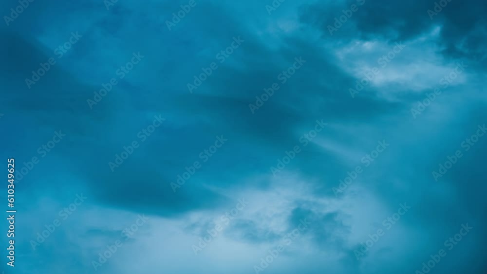 Moody stormy clouds blowing in blue sky at the dusk Moody stormy clouds blowing in blue sky at the dusk