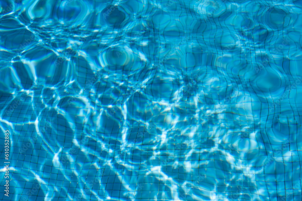 The texture of the water in the summer pool close-up