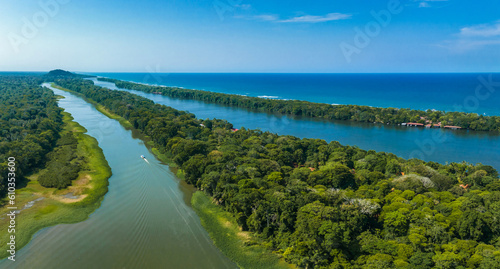 Caribbean sea on the one side, village Tortuguero inside the jungle in the middle, and huge river on the otjer side. Amazing place full of wildlife in Costa Rica photo