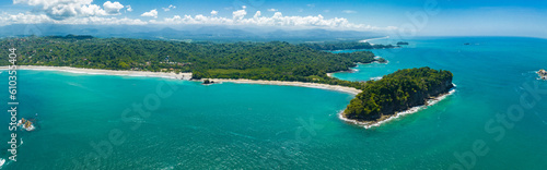 Aerial view of Manuel Antonio National Park in Costa Rica. The best Tourist Attraction and Nature Reserve with lots of Wildlife, Tropical Plants and paradisiacal Beaches on the Pacific Coast. © Aerial Film Studio