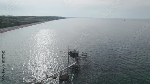 Impressive fishing platforms on stilts on the trabocchi coast of Abruzzo, Punta Aderci, Italy 4k drone
