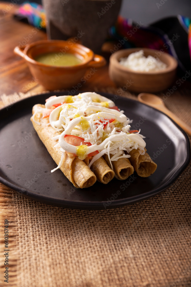Tacos Dorados. Mexican dish also known as Flautas, consists of a rolled corn tortilla with some filling, commonly chicken or beef or vegetarian options such as potatoes. Tacos Dorados. Mexican dish also known as Flautas, consists of a rolled corn tortilla with some filling, commonly chicken or beef or vegetarian options such as potatoes.