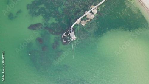 Impressive fishing platforms on stilts on the trabocchi coast of Abruzzo, Punta Aderci, Italy 4k drone