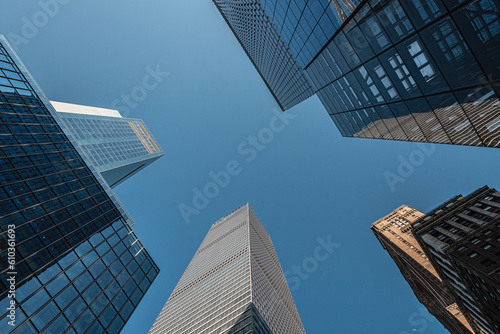 Low view of skyscrapers on blue sky
