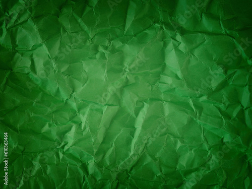 A crumpled green paper background