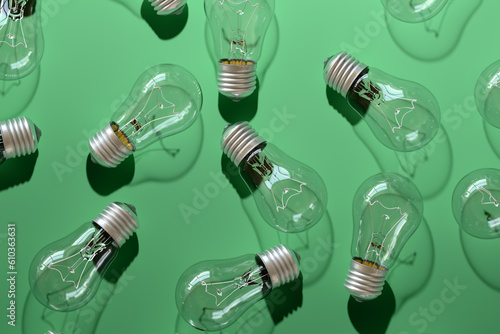 Close-up of an incandescent lamp on green background.