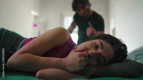 Εκτύπωση καμβά Depressed wife suffering from bad relationship while lying in bed listening to Angry husband yelling