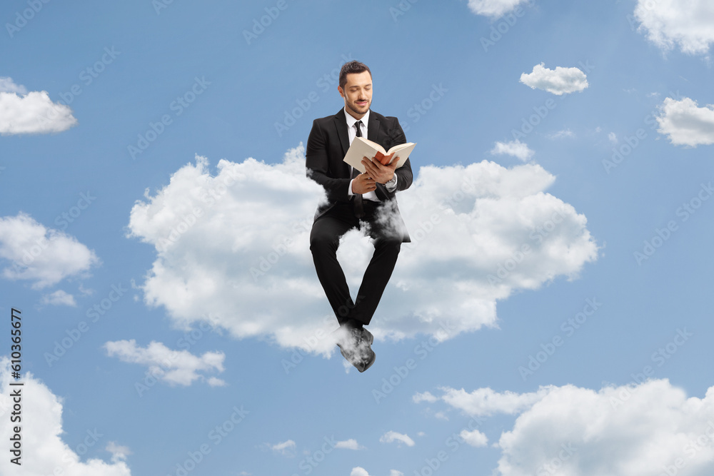 Full length portrait of a professional man in a suit sitting on a cloud Full length portrait of a professional man in a suit sitting on a cloud