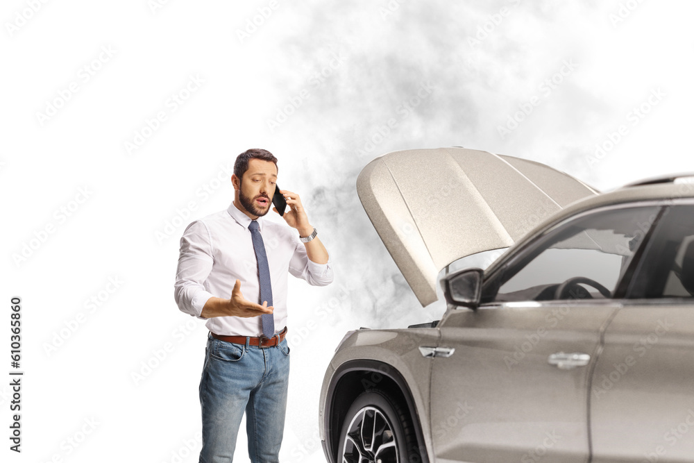 Man with a car problem calling a road help company Man with a car problem calling a road help company