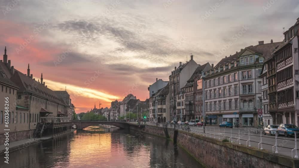 Strasbourg France time lapse 4K, city skyline night to day sunrise timelapse at Ill River with colorful half timber house Strasbourg France time lapse 4K, city skyline night to day sunrise timelapse at Ill River with colorful half timber house
