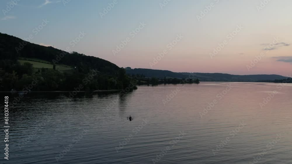sunset over the lake and kayak in Switzerland during summer sunset over the lake and kayak in Switzerland during summer